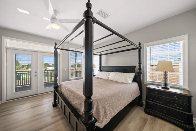 a bed sitting in a bedroom next to a window