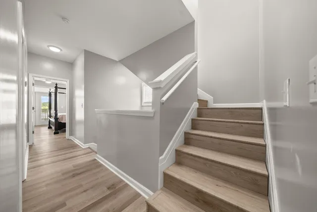 a spacious bedroom with a large bed and a window