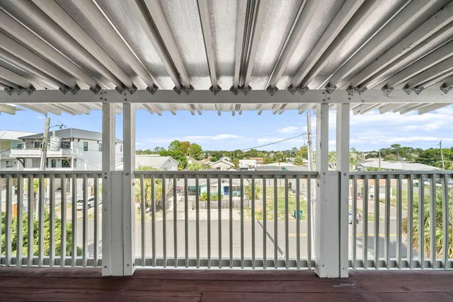 a view of a porch with wooden floor
