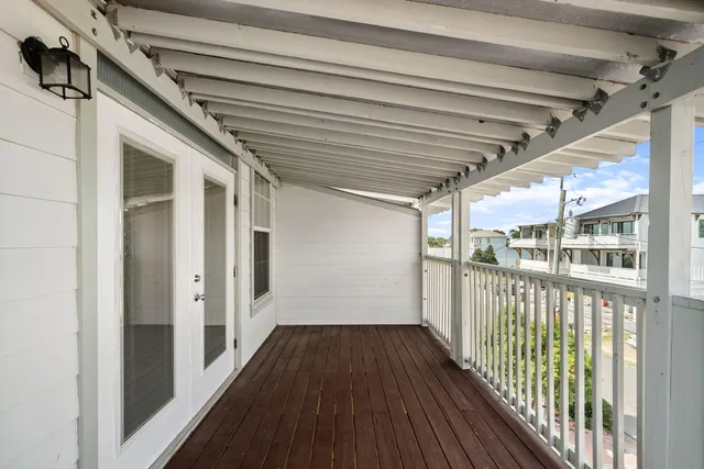 a view of a balcony with wooden floor
