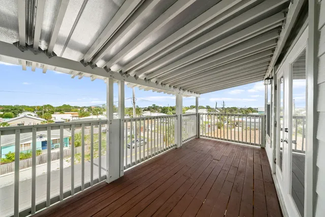 a bedroom with a bed lamp closet and window