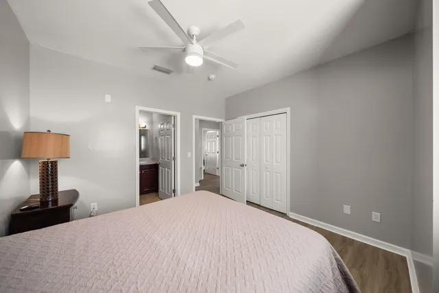 a bathroom with a toilet a sink and a mirror