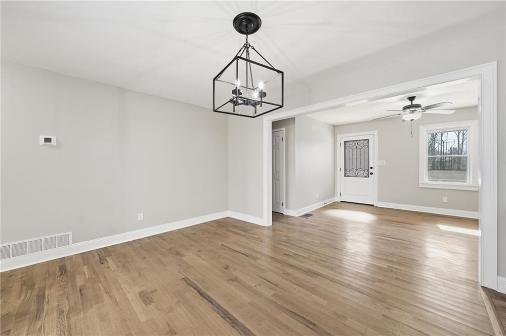 2702 Beecher Drive Austell, GA 30106 - Photo 14 of 27 a view of an empty room with wooden floor and a window