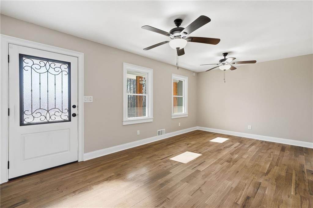 2702 Beecher Drive Austell, GA 30106 - Photo 4 of 27 wooden floor in an empty room with a window