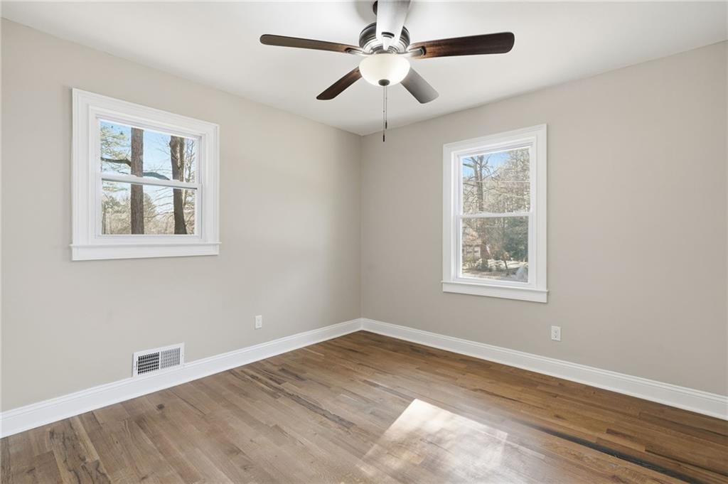 2702 Beecher Drive Austell, GA 30106 - Photo 6 of 27 a view of empty room with wooden floor and fan