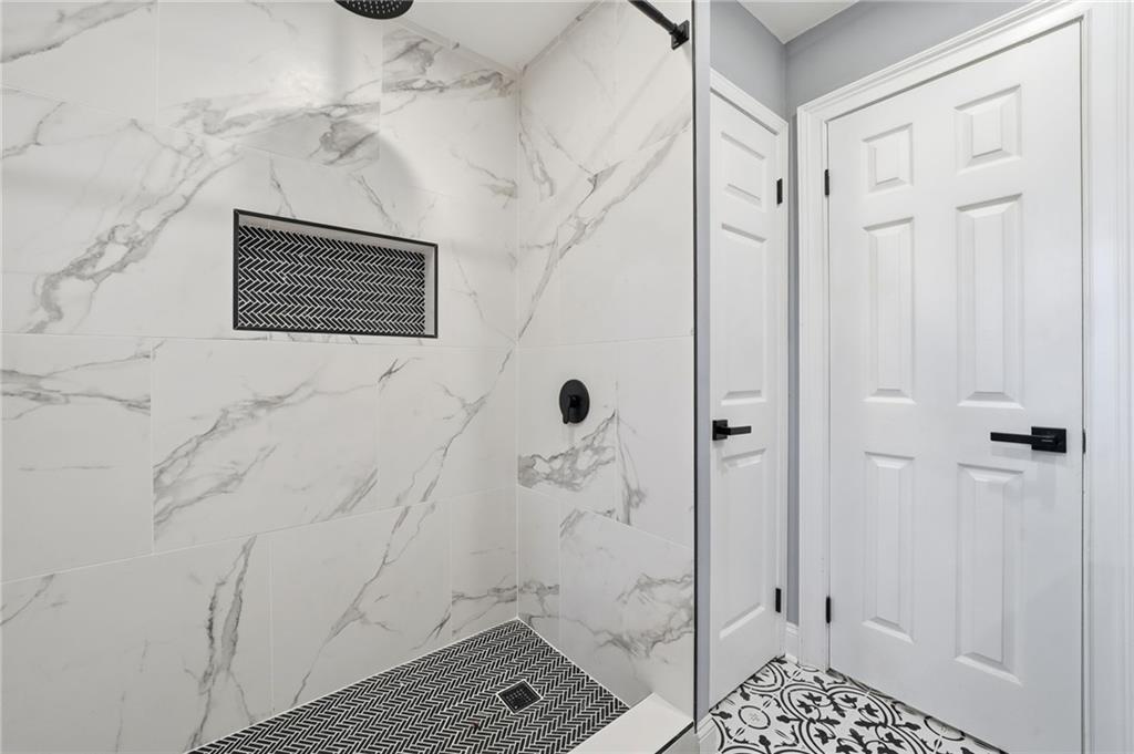 2702 Beecher Drive Austell, GA 30106 - Photo 9 of 27 a bathroom with a shower