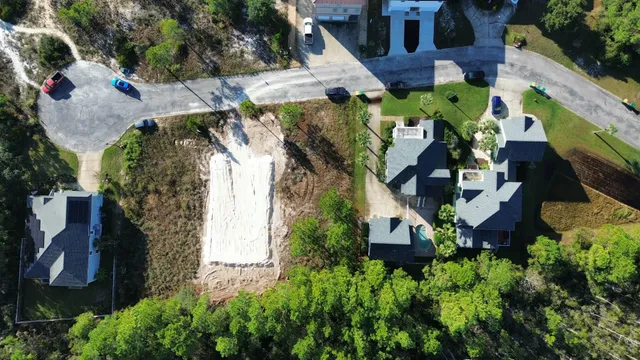 an aerial view of houses with outdoor space