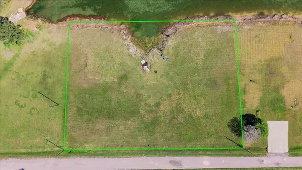 a bathroom with a shower curtain and a small yard
