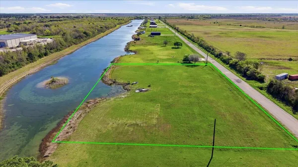 a view of a swimming pool and an outdoor seating