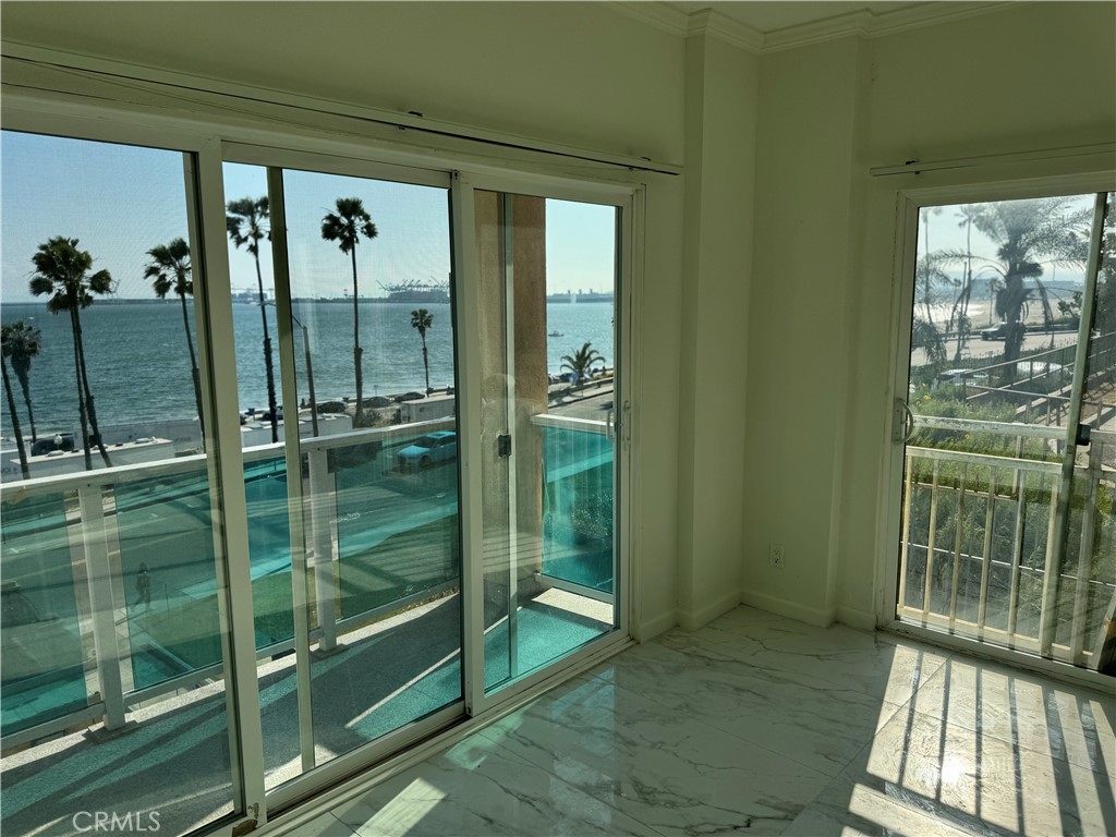 2230 East Ocean Boulevard, Unit 9 Long Beach, CA 90803 - Photo 4 of 16 a bathroom with a glass door shower and sink