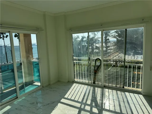 a view of balcony with floor to ceiling window