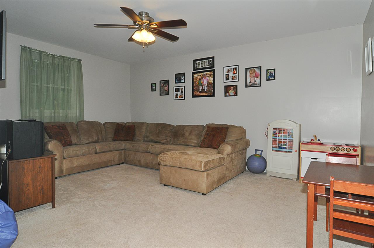 756 Advance Mills Road Ruckersville, VA 22968 - Photo 13 of 29 a living room with furniture and a lamp