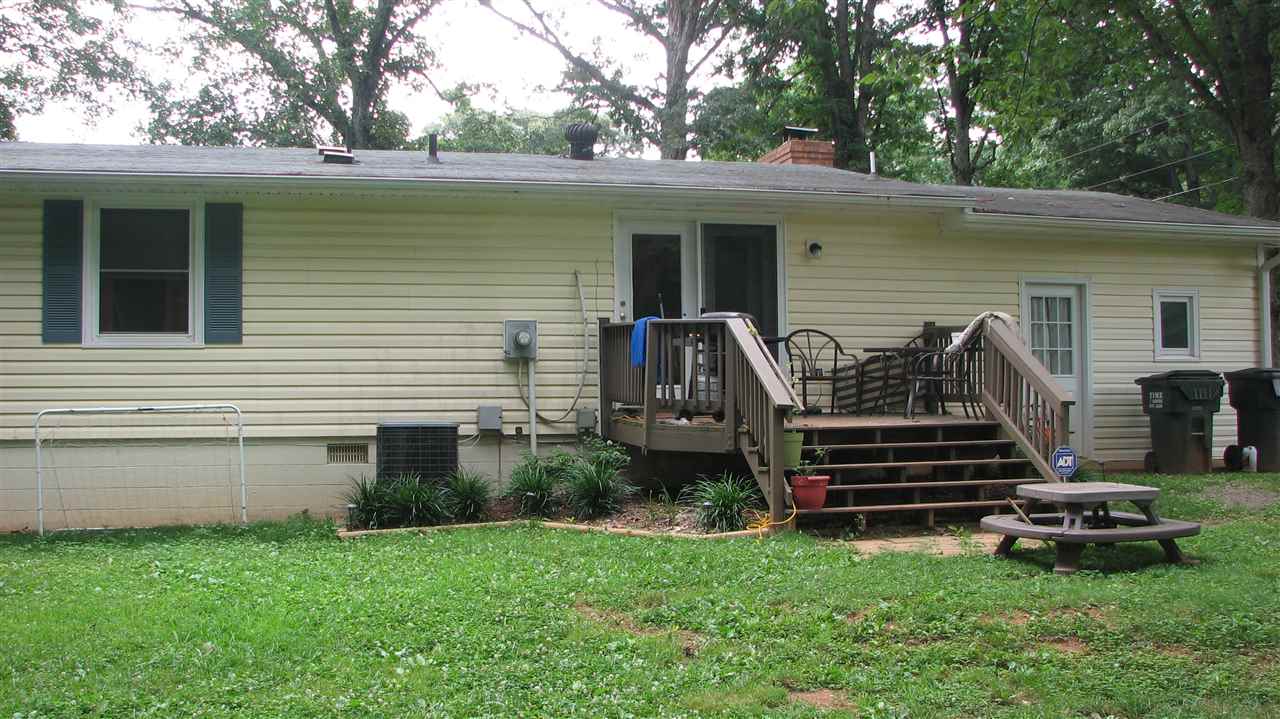 756 Advance Mills Road Ruckersville, VA 22968 - Photo 3 of 29 a front view of a house with a garden