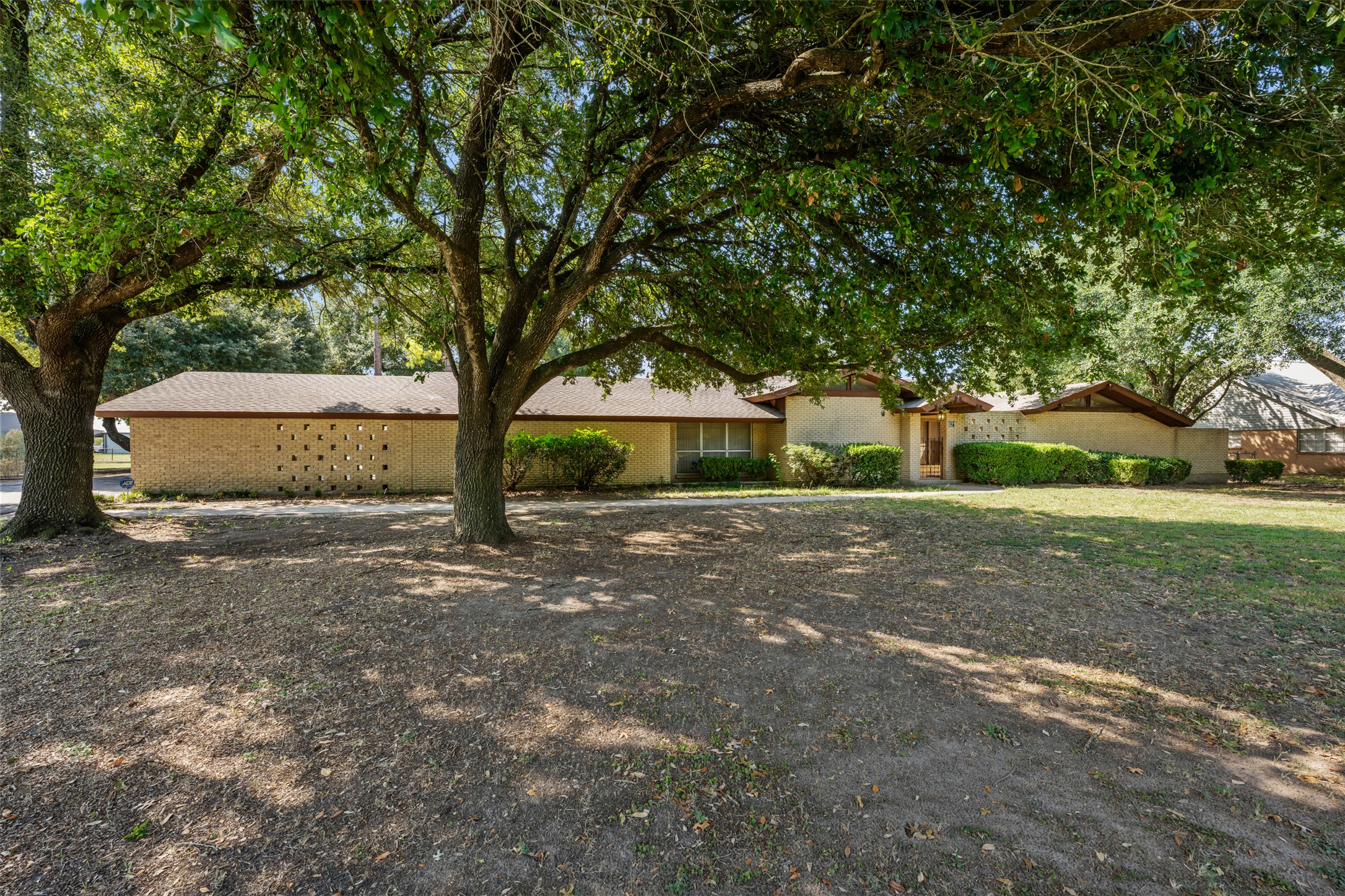 821 Central Avenue Elgin, TX 78621 - Photo 1 of 1 a front view of a house with a yard and garage