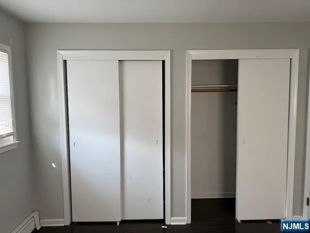 a view of hallway with wooden floor