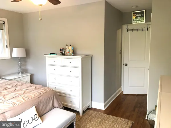 a bedroom with a bed and a cabinets