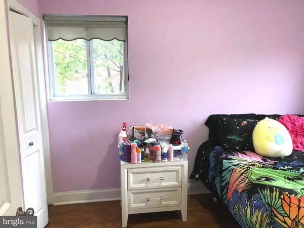 a bed room with a bed and a window