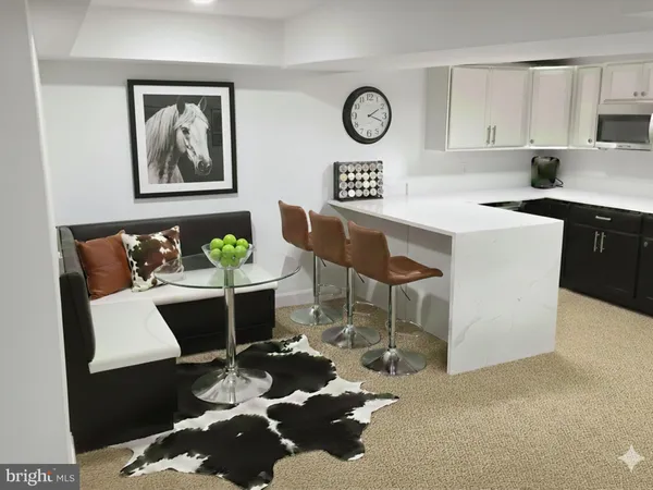 a kitchen with a table and chairs in it