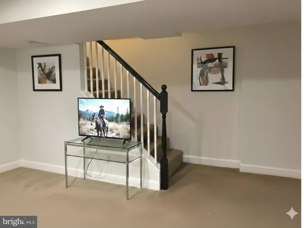 a view of a hallway with staircase