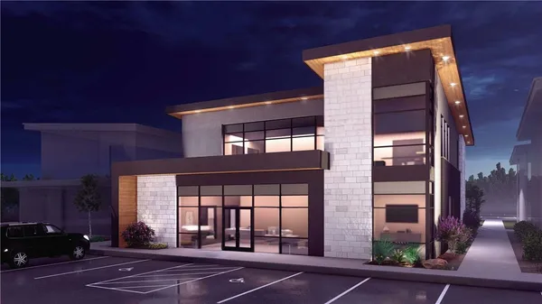 an aerial view of a house with a yard