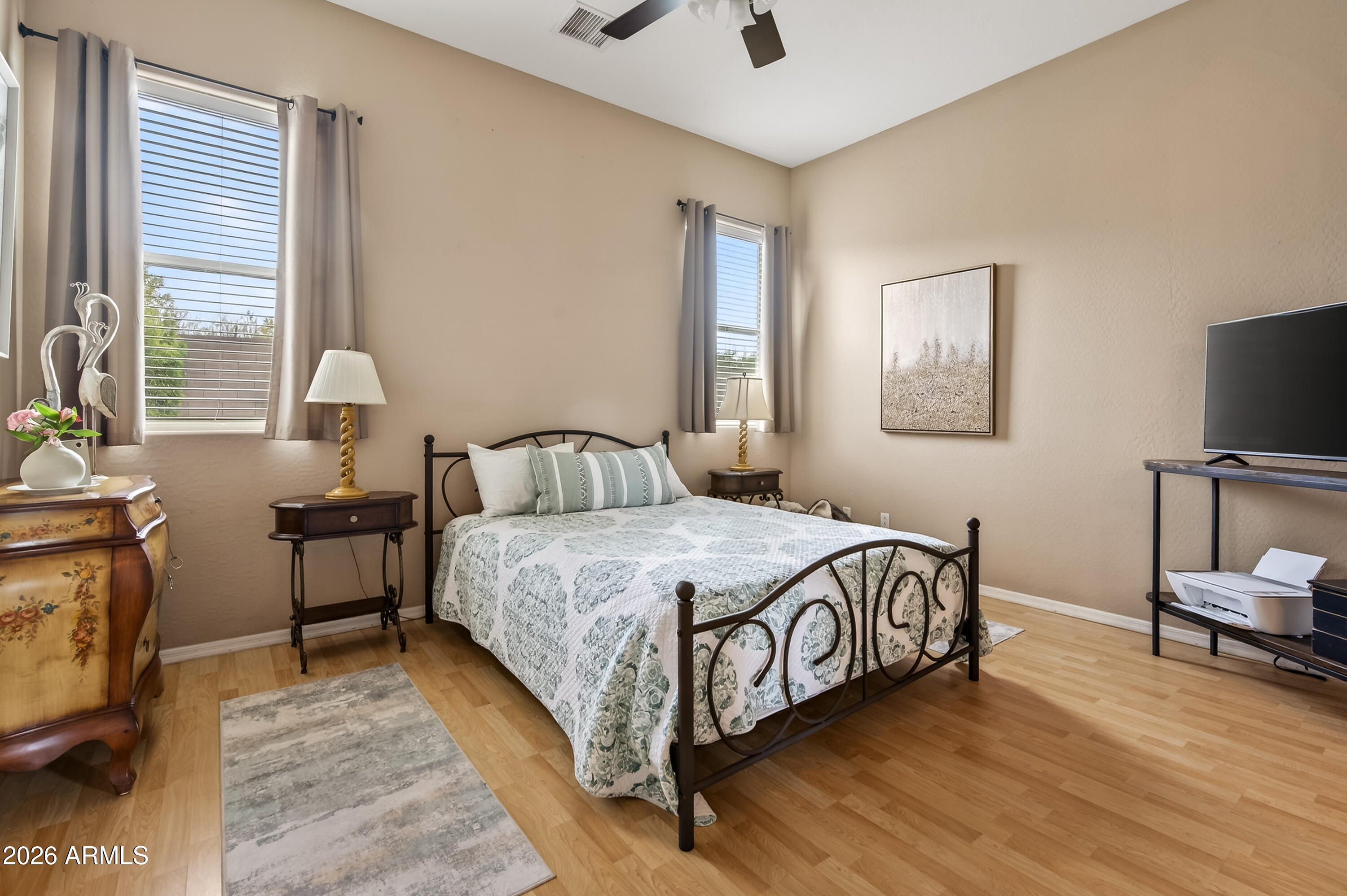654 South Elk Ridge Drive Camp Verde, AZ 86322 - Photo 20 of 34 a bedroom with a bed and a flat tv screen on the dresser