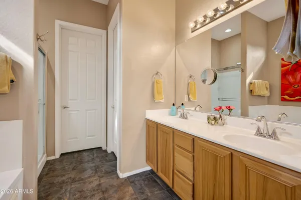 a bathroom with a double vanity sink mirror and