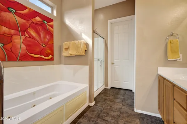 a bathroom with a tub and shower