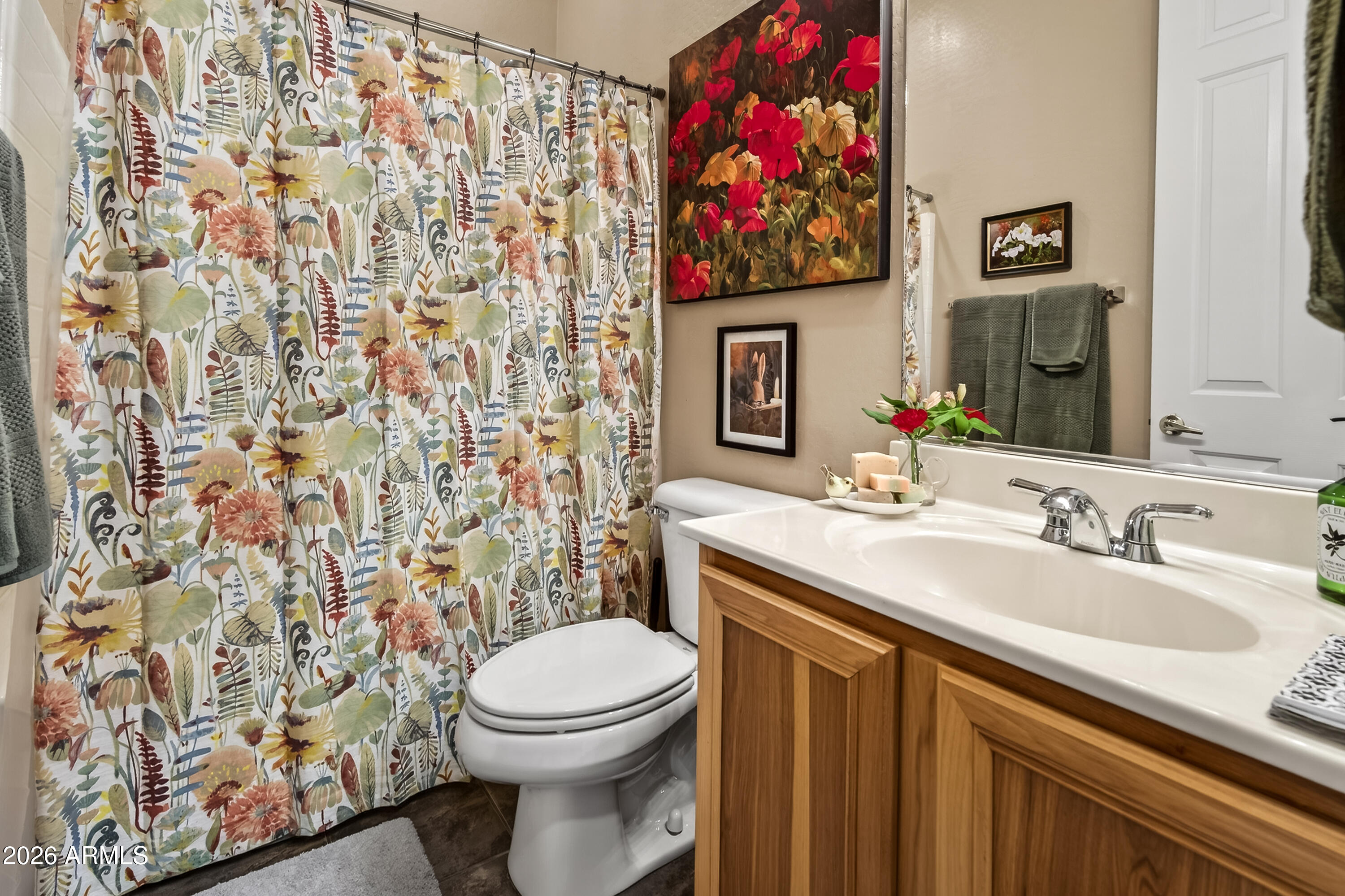 654 South Elk Ridge Drive Camp Verde, AZ 86322 - Photo 25 of 34 a bathroom with a toilet sink vanity and shower