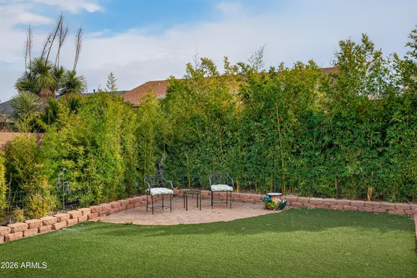 a view of a swimming pool with a yard