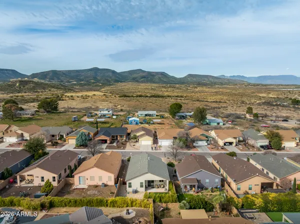 an aerial view of residential building and lake