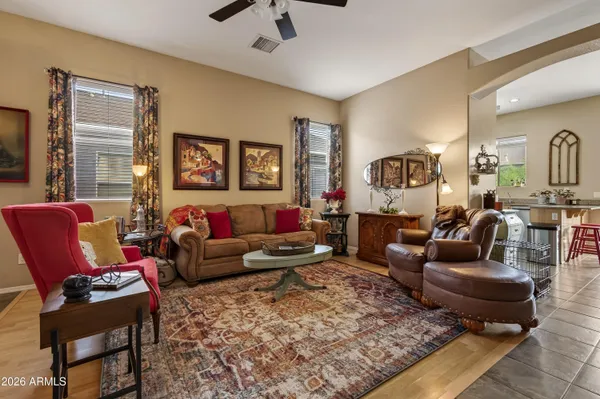 a living room with furniture and a rug