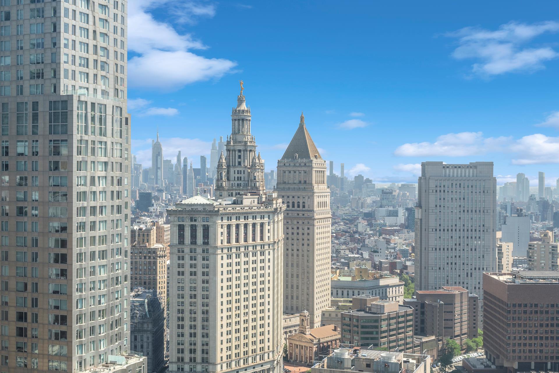 130 William Street, Unit 38A Manhattan, NY 10038 - Photo 10 of 12 a view of city with tall buildings