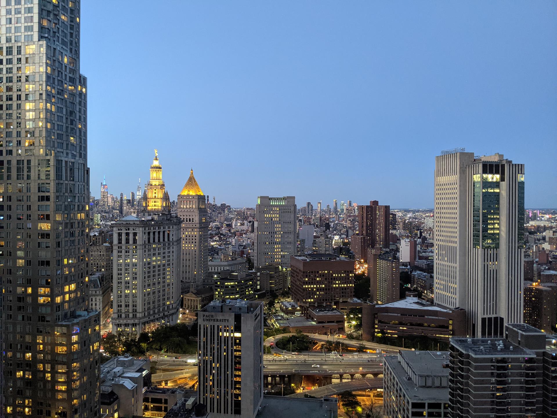 130 William Street, Unit 38A Manhattan, NY 10038 - Photo 7 of 12 a view of a city with tall buildings
