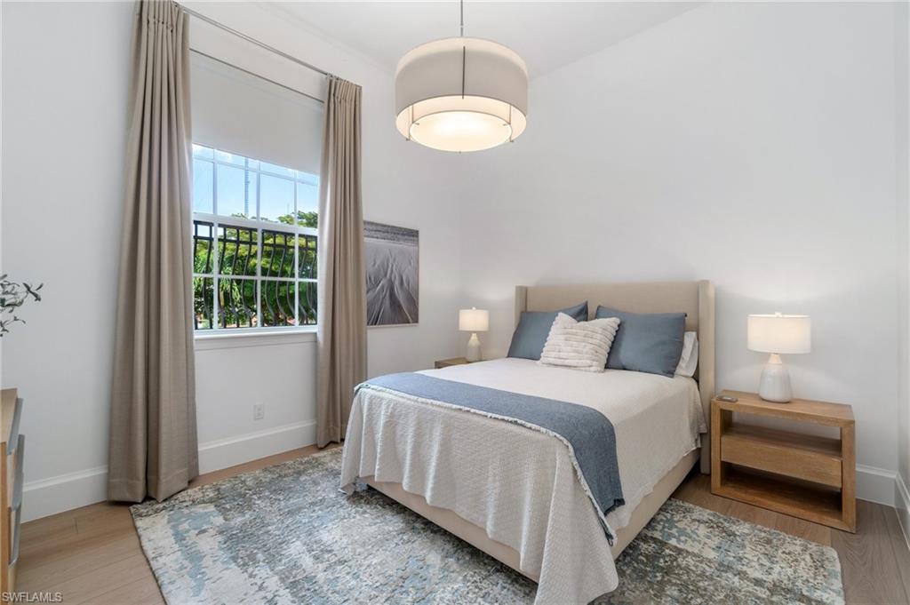 17010 Porta Vecchio Way, Unit 201 Naples, FL 34110 - Photo 15 of 50 a bedroom with a bed and a window