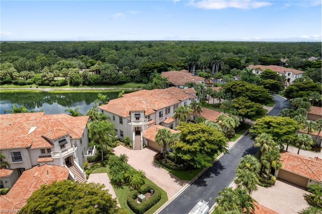 17010 Porta Vecchio Way, Unit 201 Naples, FL 34110 - Photo 25 of 50 an aerial view of a house with a lake view