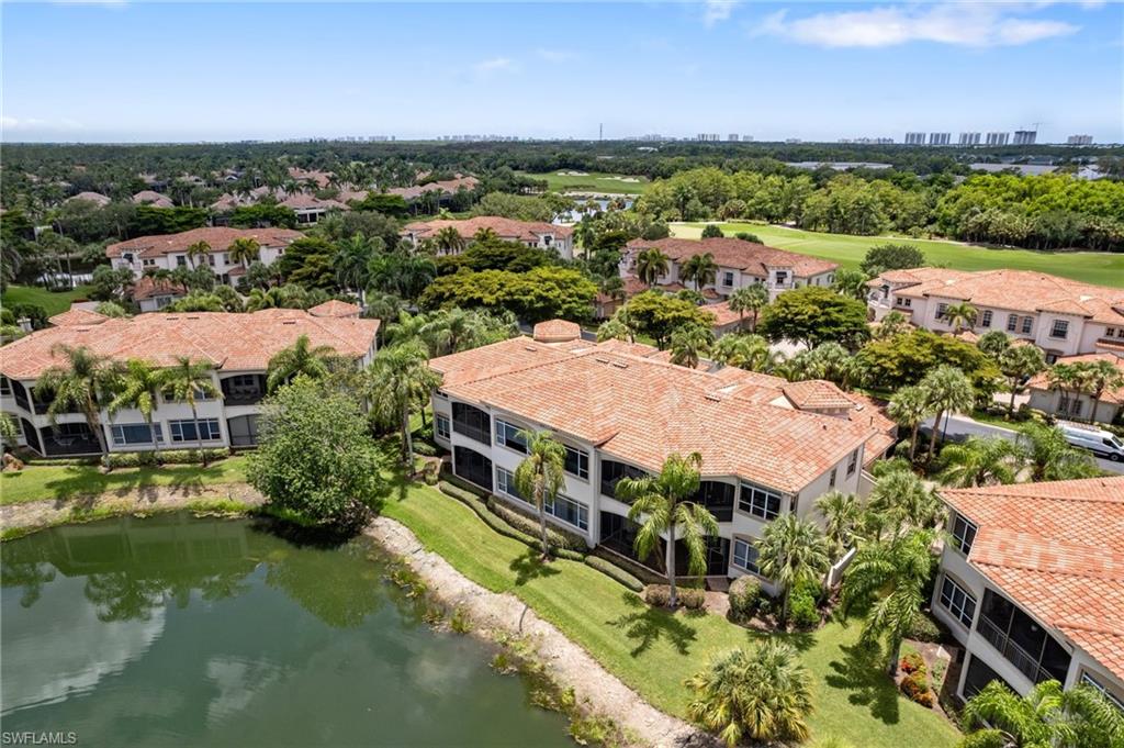 17010 Porta Vecchio Way, Unit 201 Naples, FL 34110 - Photo 26 of 50 an aerial view of residential houses with outdoor space and river