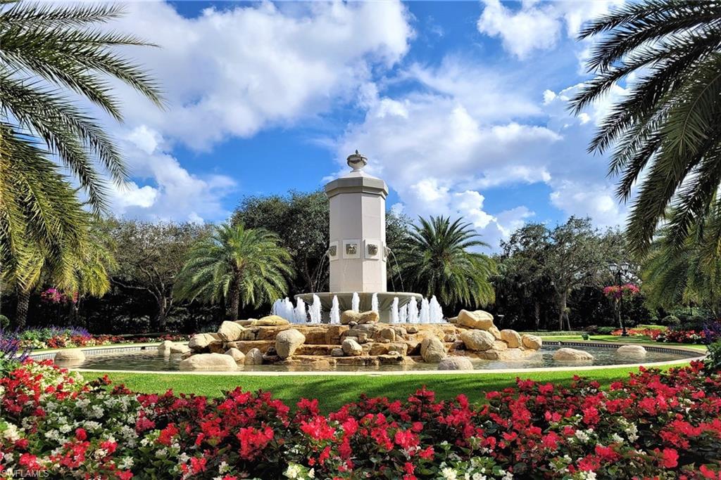 17010 Porta Vecchio Way, Unit 201 Naples, FL 34110 - Photo 28 of 50 a view of a fountain in front of house with palm trees