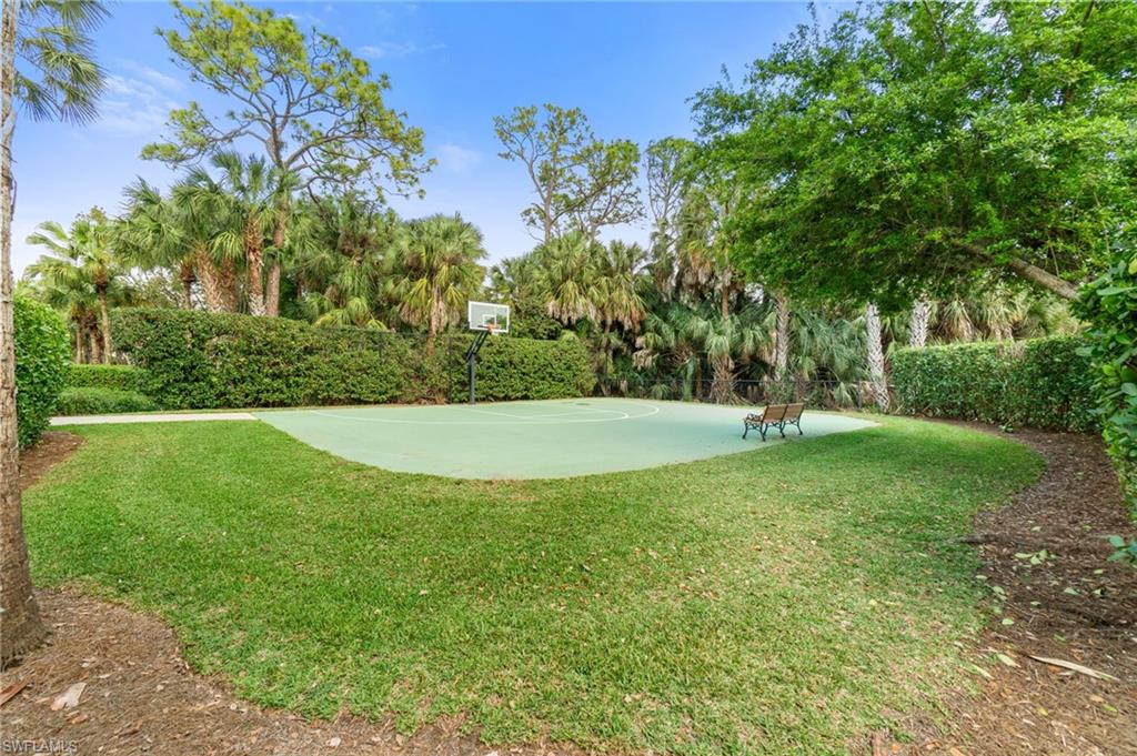 17010 Porta Vecchio Way, Unit 201 Naples, FL 34110 - Photo 39 of 50 a view of a garden with a tree