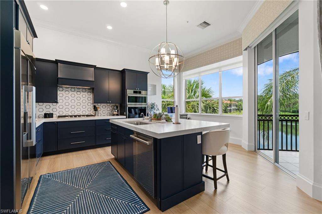 17010 Porta Vecchio Way, Unit 201 Naples, FL 34110 - Photo 6 of 50 a bathroom with a sink and a large window