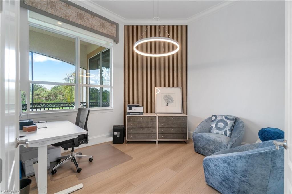 17010 Porta Vecchio Way, Unit 201 Naples, FL 34110 - Photo 10 of 50 a living room with furniture and a large window
