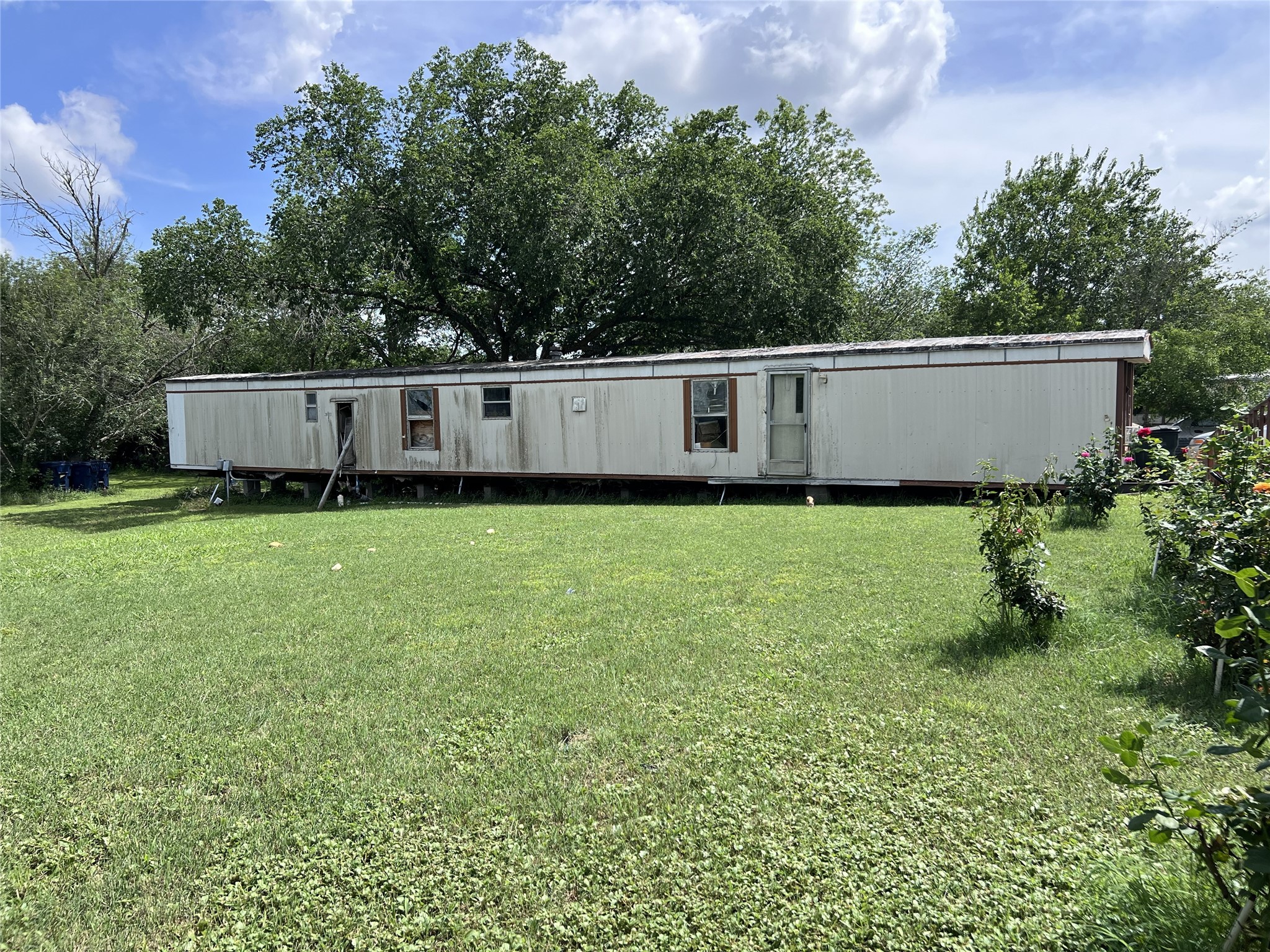 10001 Peterson Road Del Valle, TX 78617 - Photo 5 of 29 a view of a house with a yard