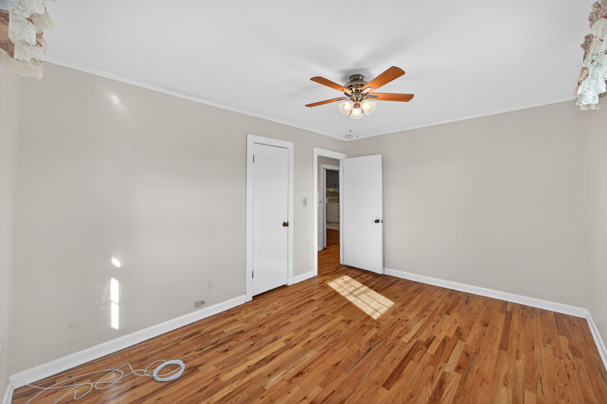 716 Dry Creek Road Smithville, TN 37166 - Photo 17 of 31 a view of a room with wooden floor and ceiling fan