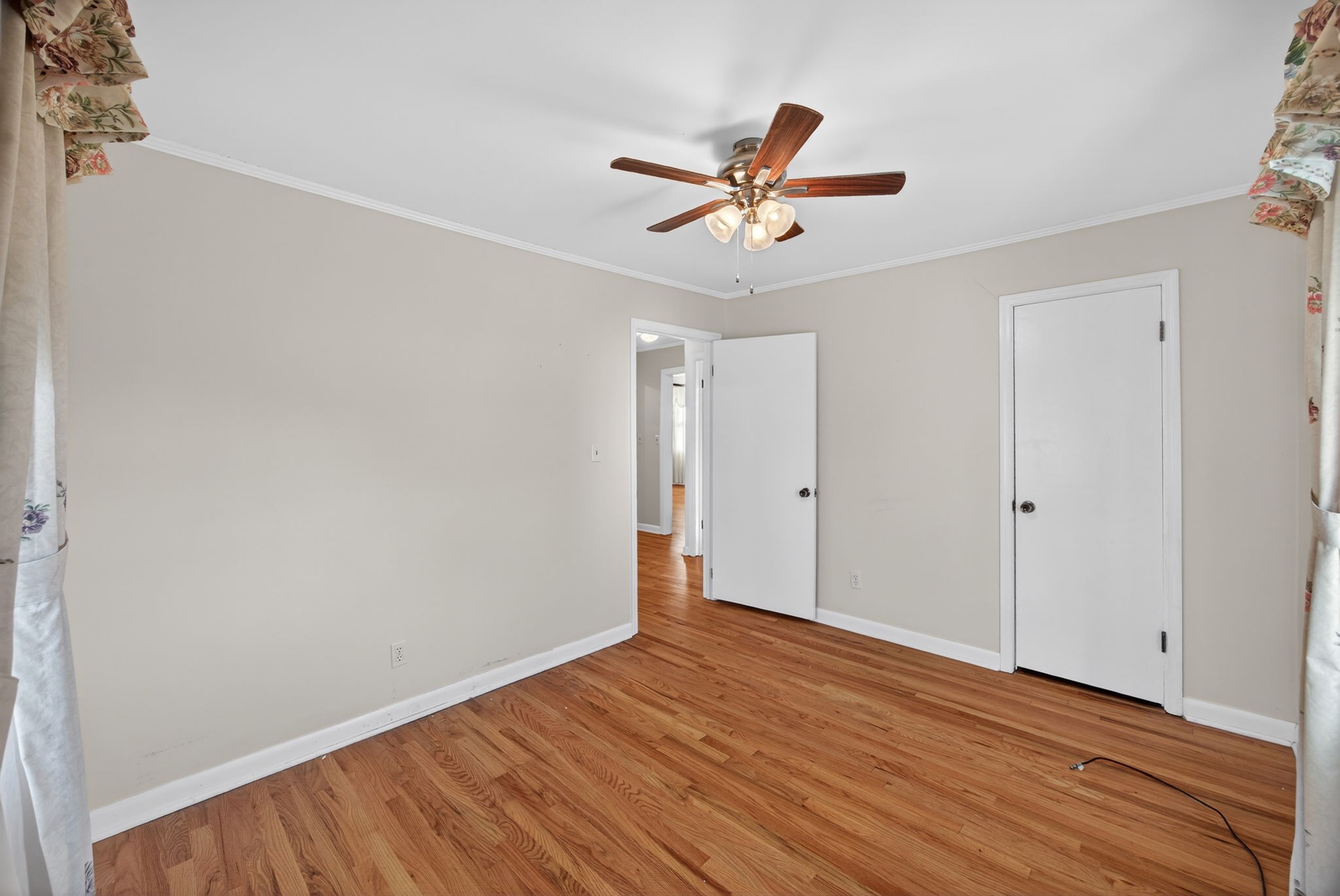 716 Dry Creek Road Smithville, TN 37166 - Photo 19 of 31 a view of a room with wooden floor and ceiling fan