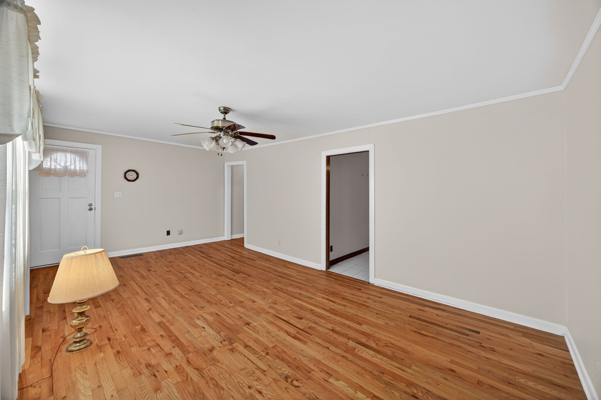 716 Dry Creek Road Smithville, TN 37166 - Photo 3 of 31 a view of a room with wooden floor and chandelier