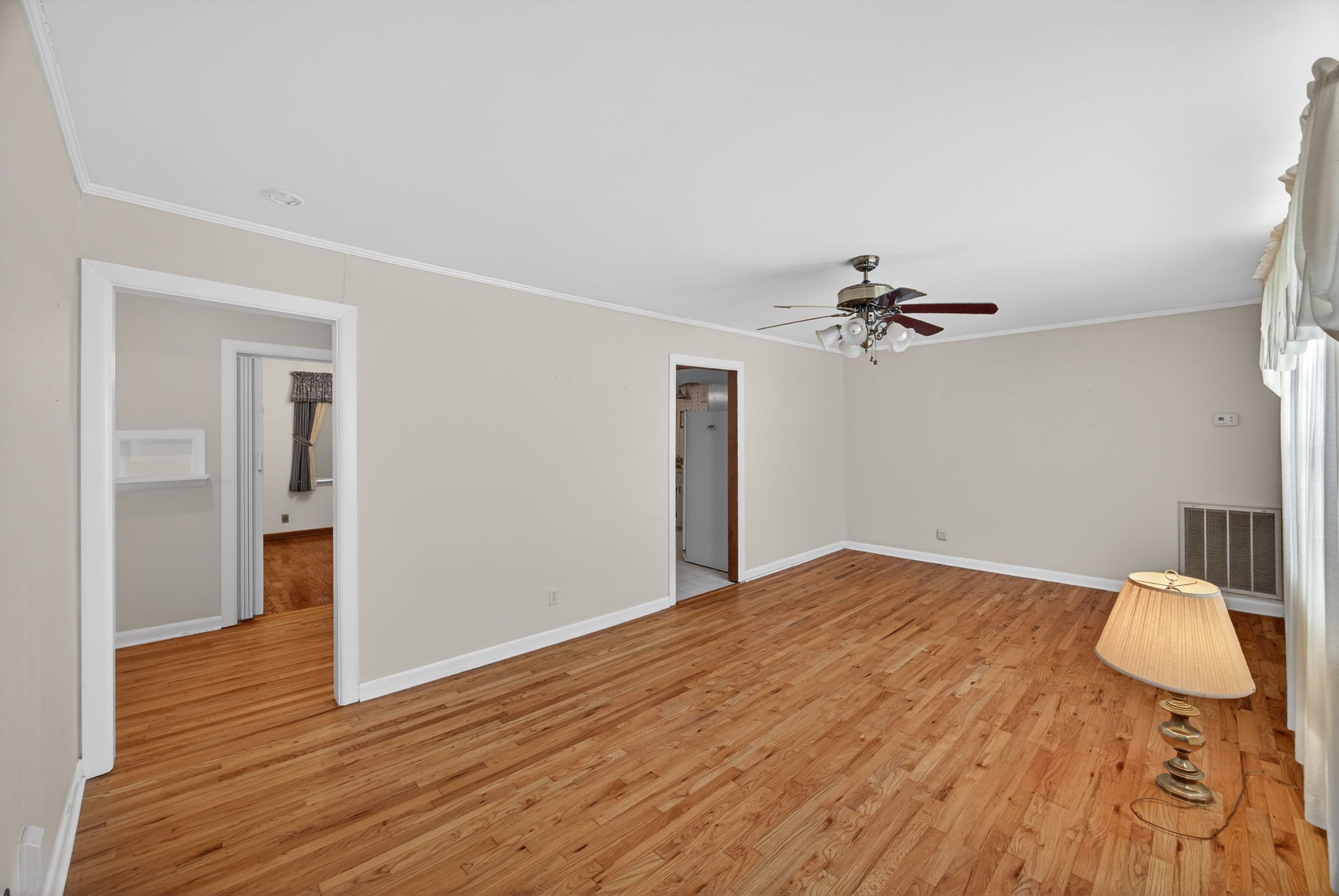 716 Dry Creek Road Smithville, TN 37166 - Photo 4 of 31 a view of a livingroom with a dresser and chandelier