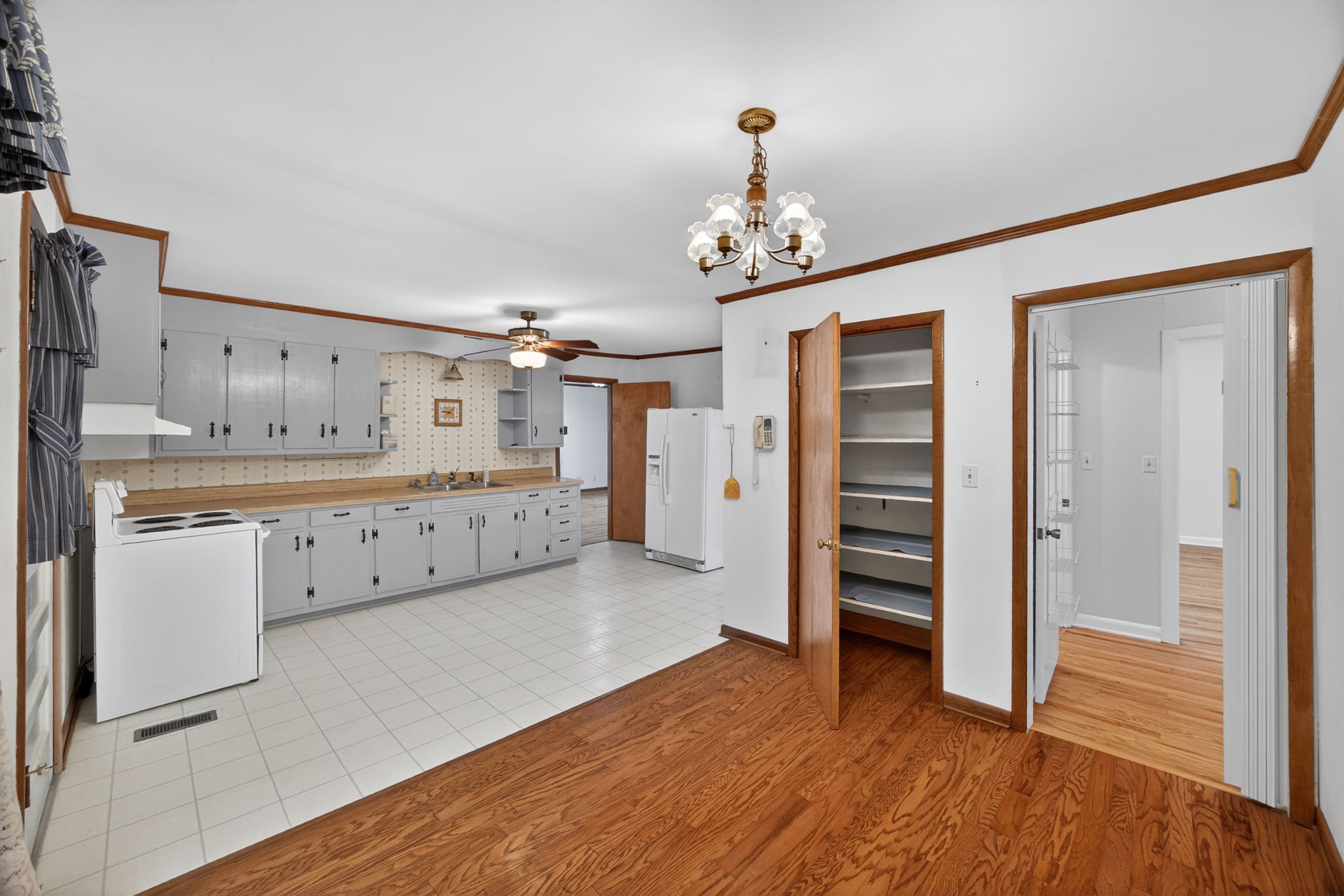716 Dry Creek Road Smithville, TN 37166 - Photo 5 of 31 a view of a kitchen with wooden floor and electronic appliances