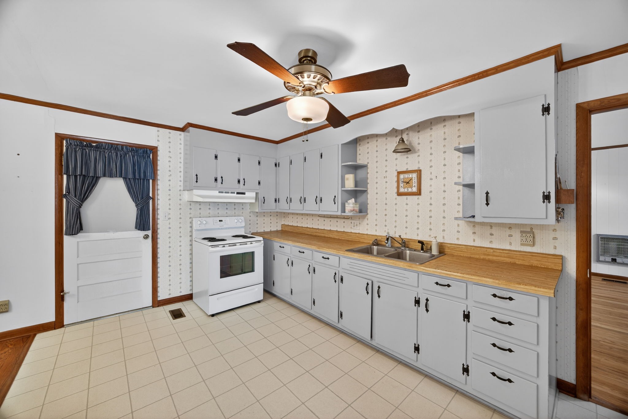 716 Dry Creek Road Smithville, TN 37166 - Photo 7 of 31 a large white kitchen with a large window and a sink