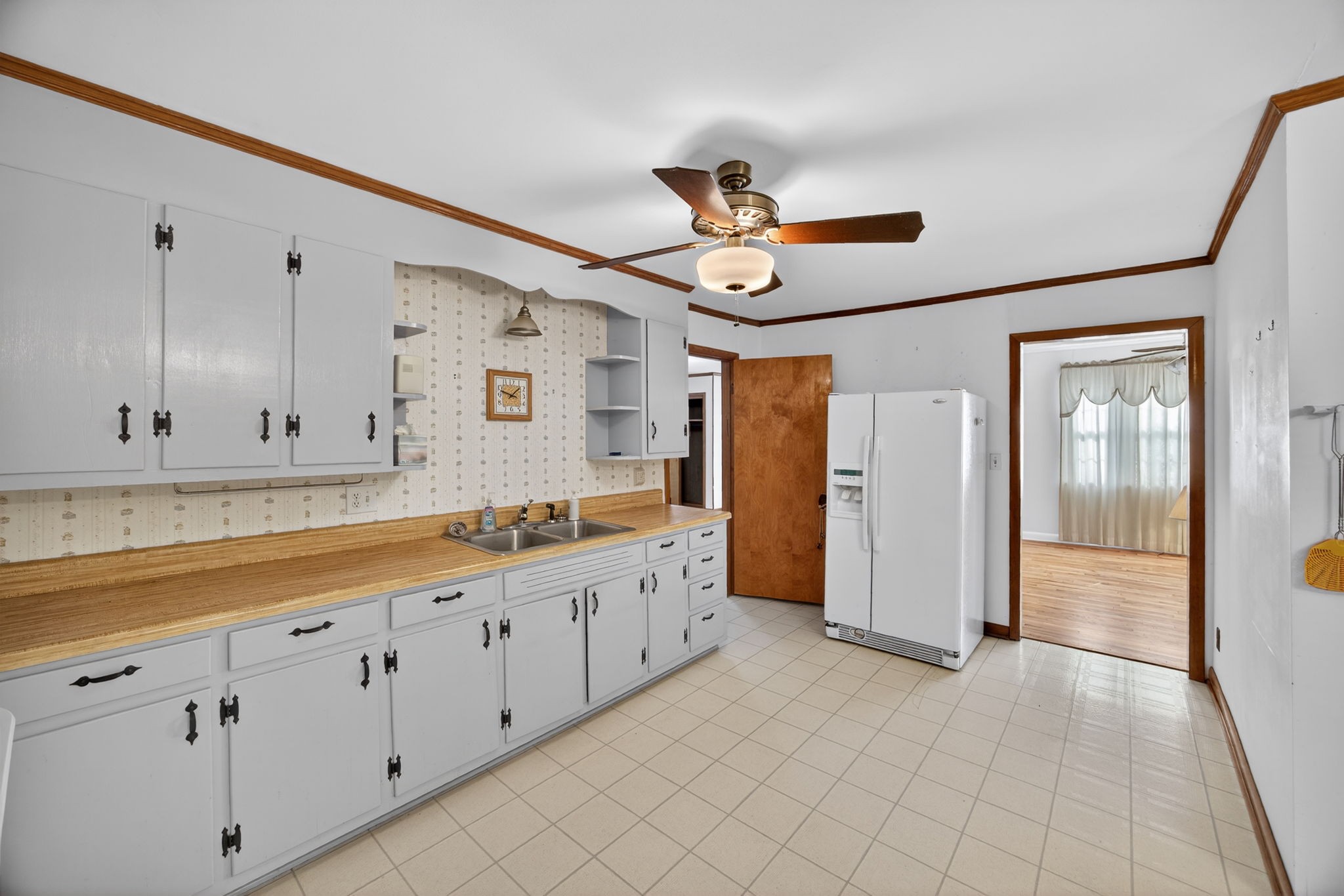 716 Dry Creek Road Smithville, TN 37166 - Photo 8 of 31 a large white kitchen with a large window