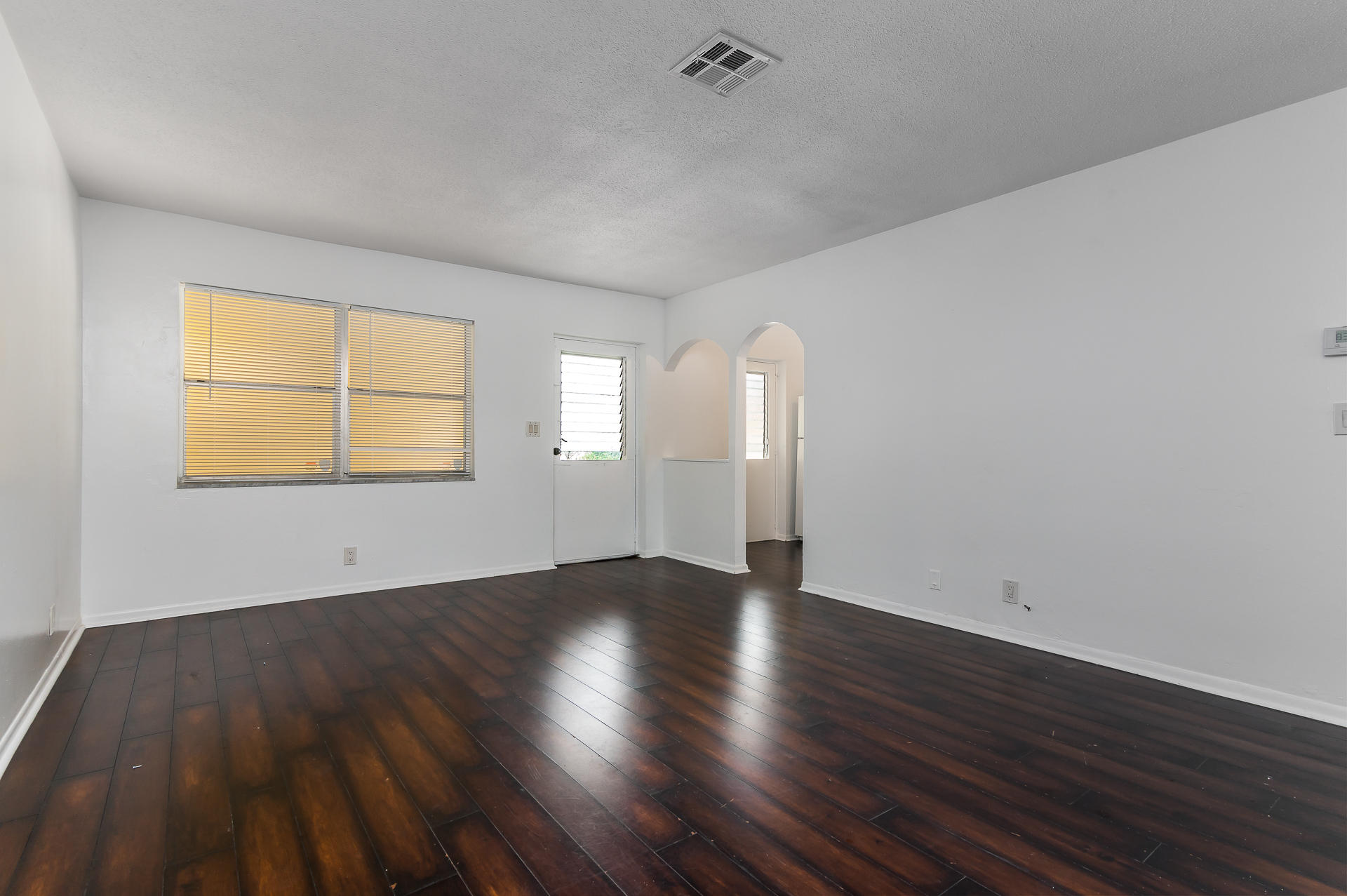 260 Northwest 19th Street, Unit 260 Boca Raton, FL 33432 - Photo 8 of 13 living room and front door