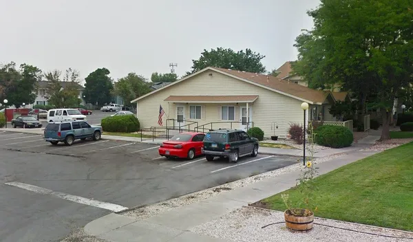 a view of multiple houses with a street